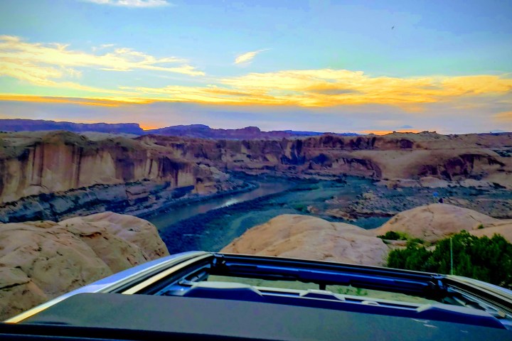 a Jeep sitting on top of a mountain